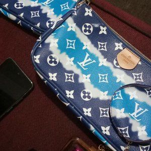 Three piece Louis Vuitton leather rochette designer bag